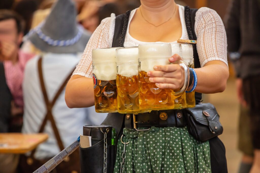 Waitress carrying beer steins at Oktoberfest